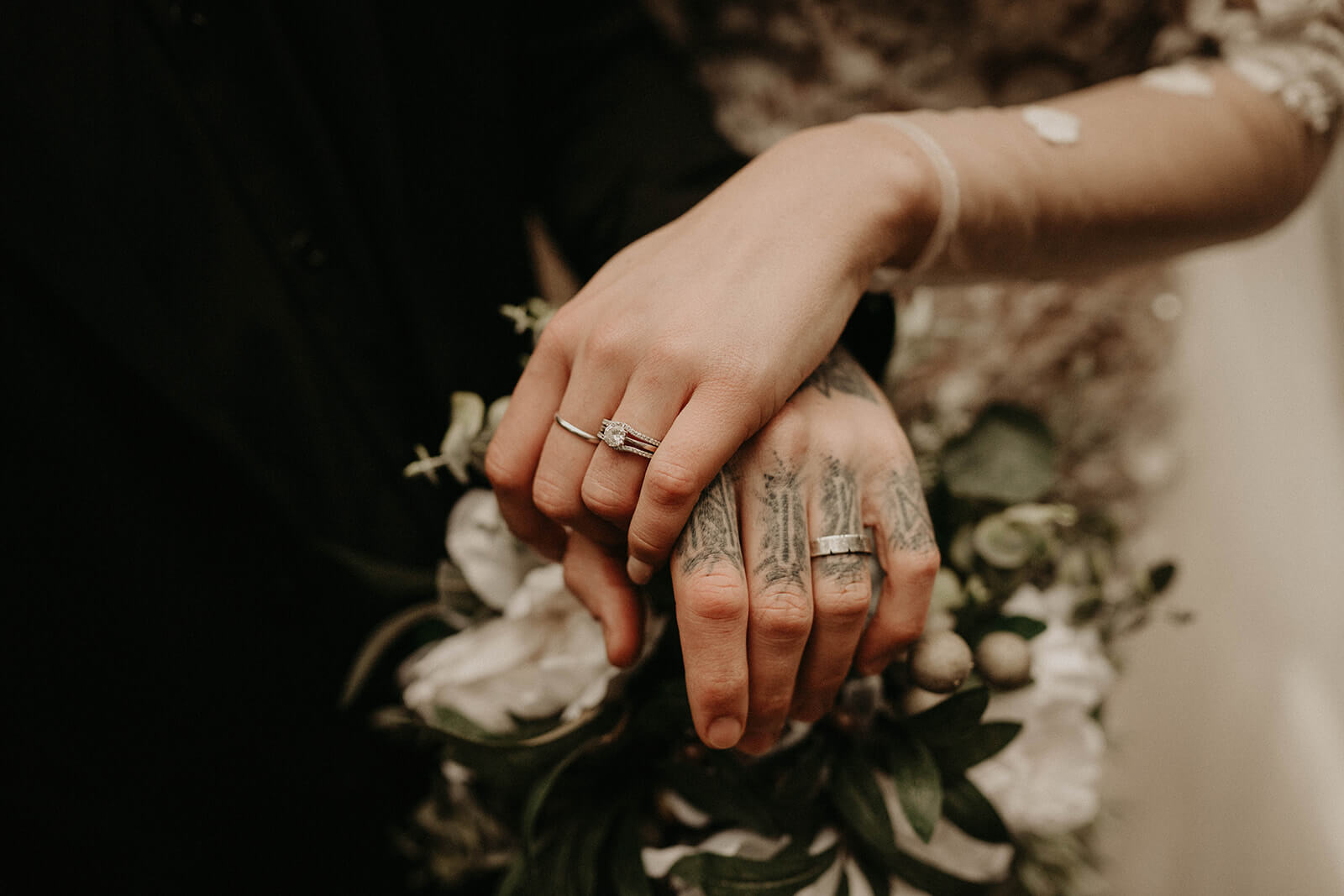 Bride and groom holding hands after elopement ceremony at Mt Rainier