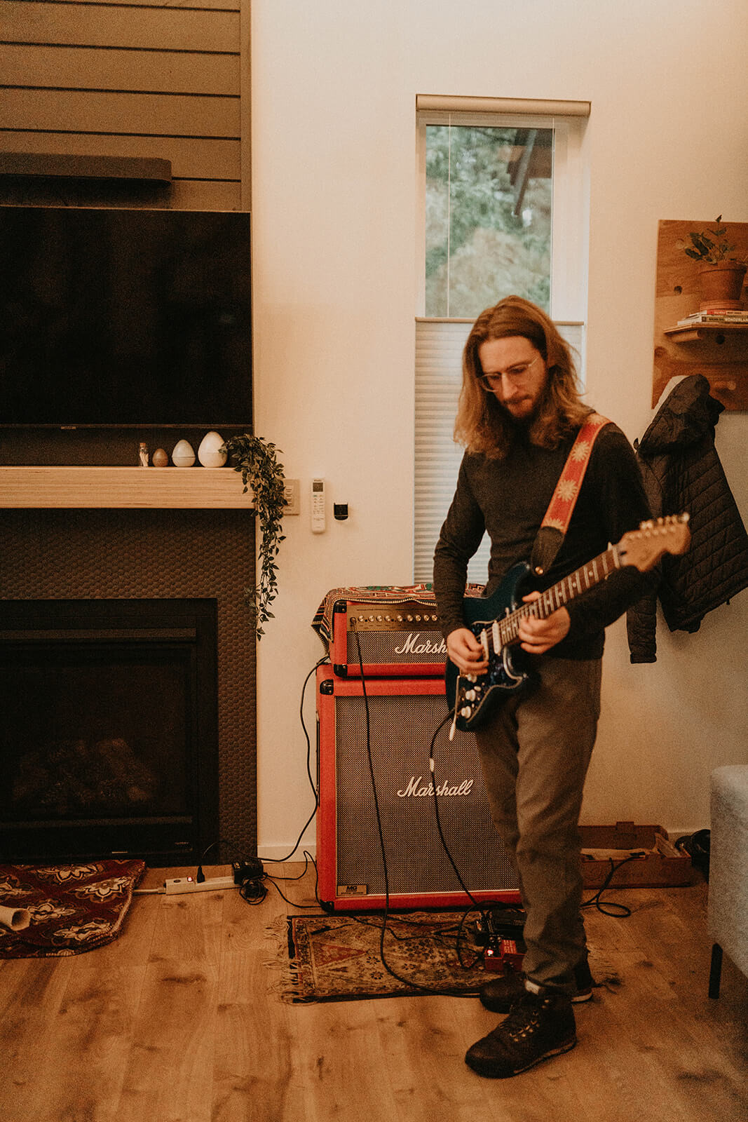 Man strumming electric guitar for Mount Rainier elopement first dance