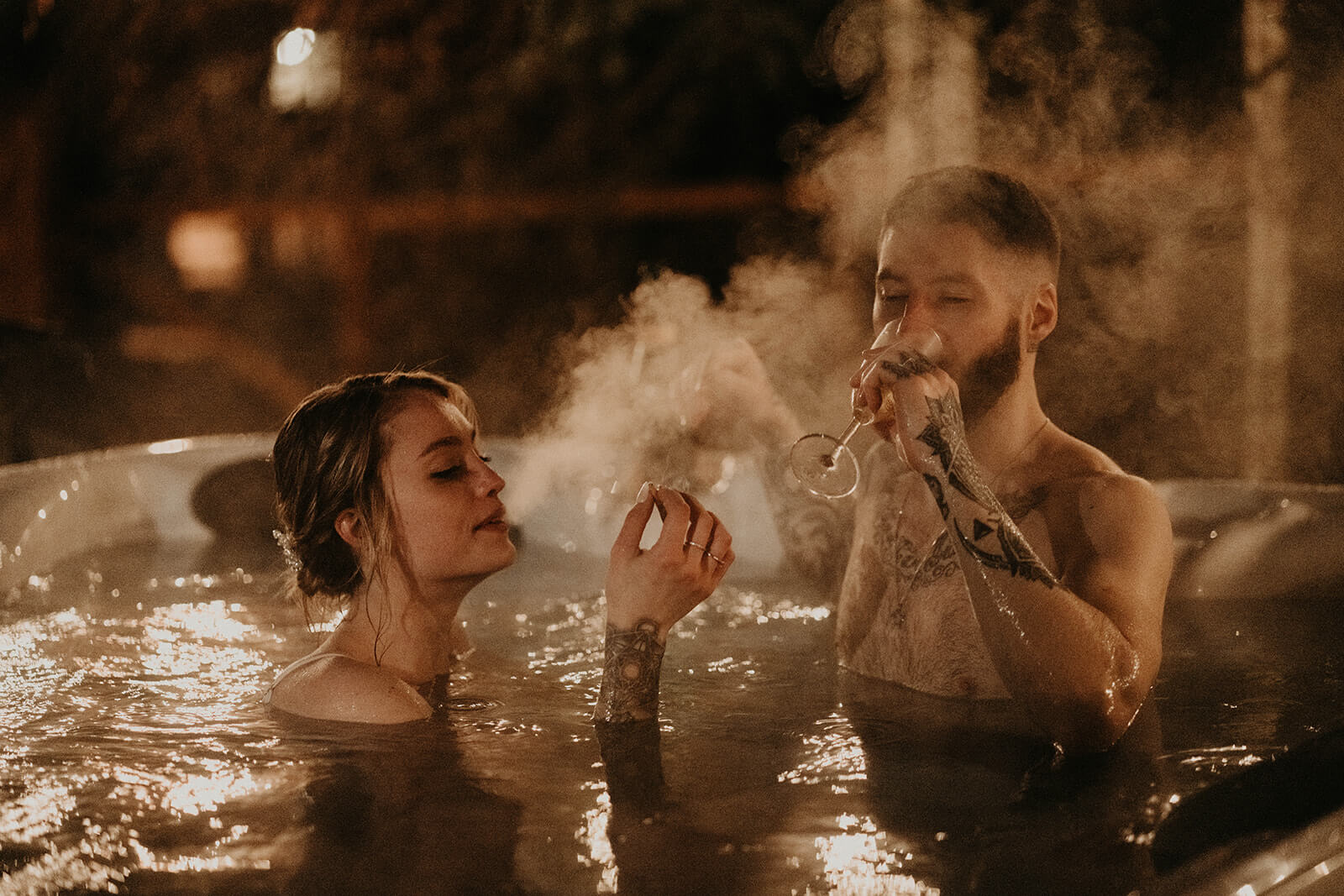 Bride and groom smoking in the hot tub at cozy cabin in Mount Rainier