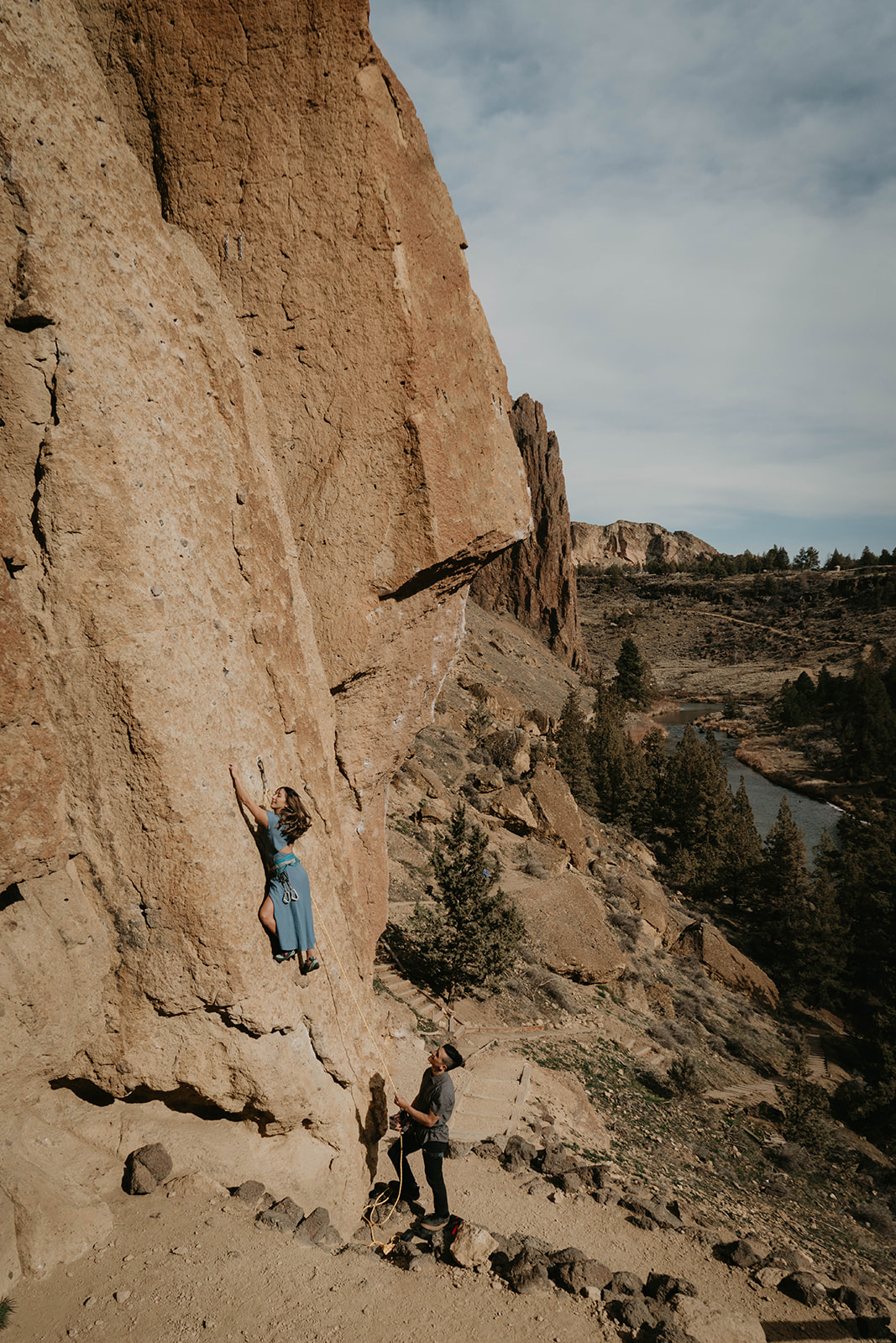 Couple rock climbing at Smith Rock for engagement session