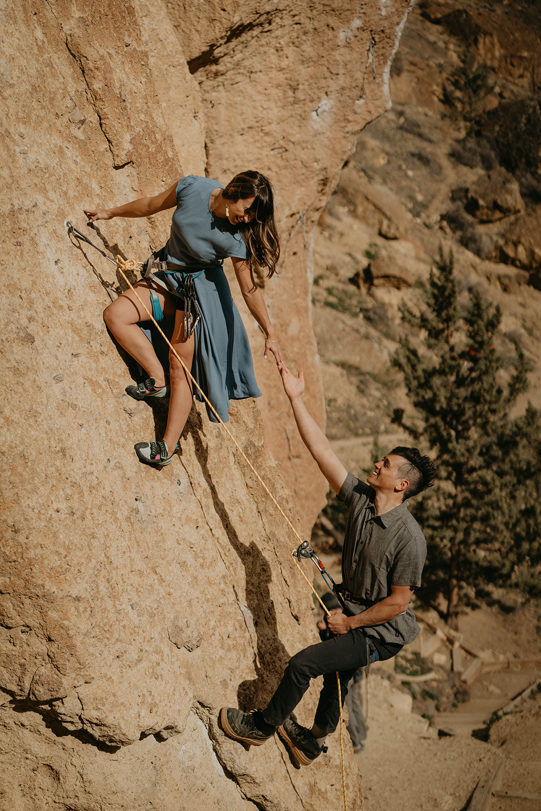 Couple rock climbing at Smith Rock for engagement session