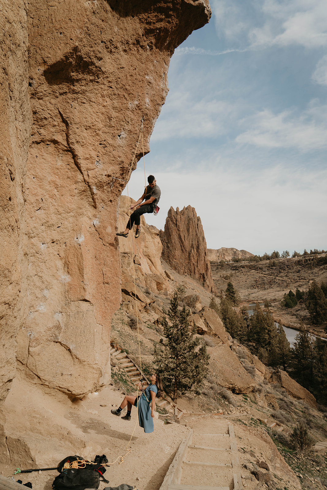 Couple rock climbing at Smith Rock for engagement session