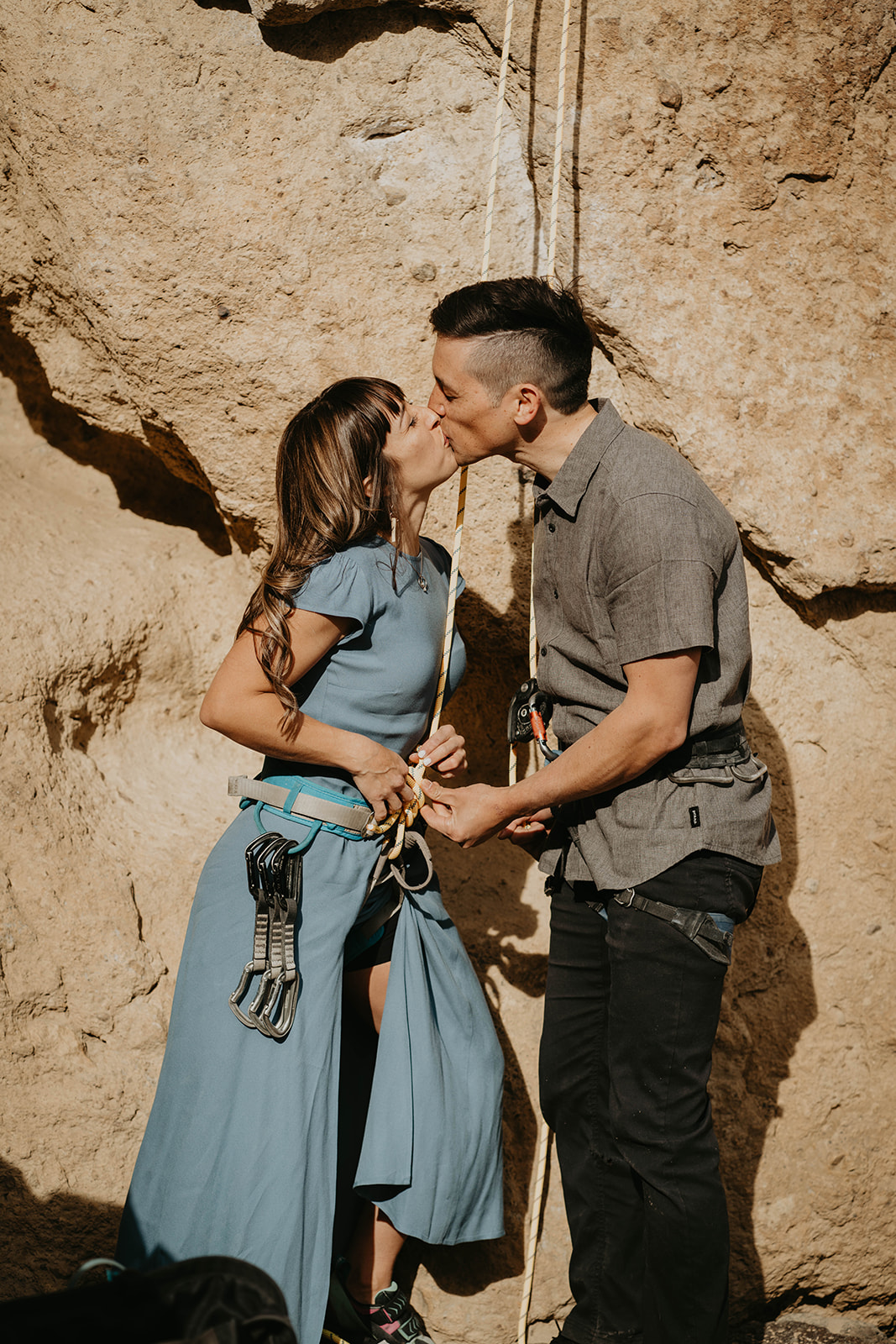 Couple kissing before rock climbing at Smith Rock