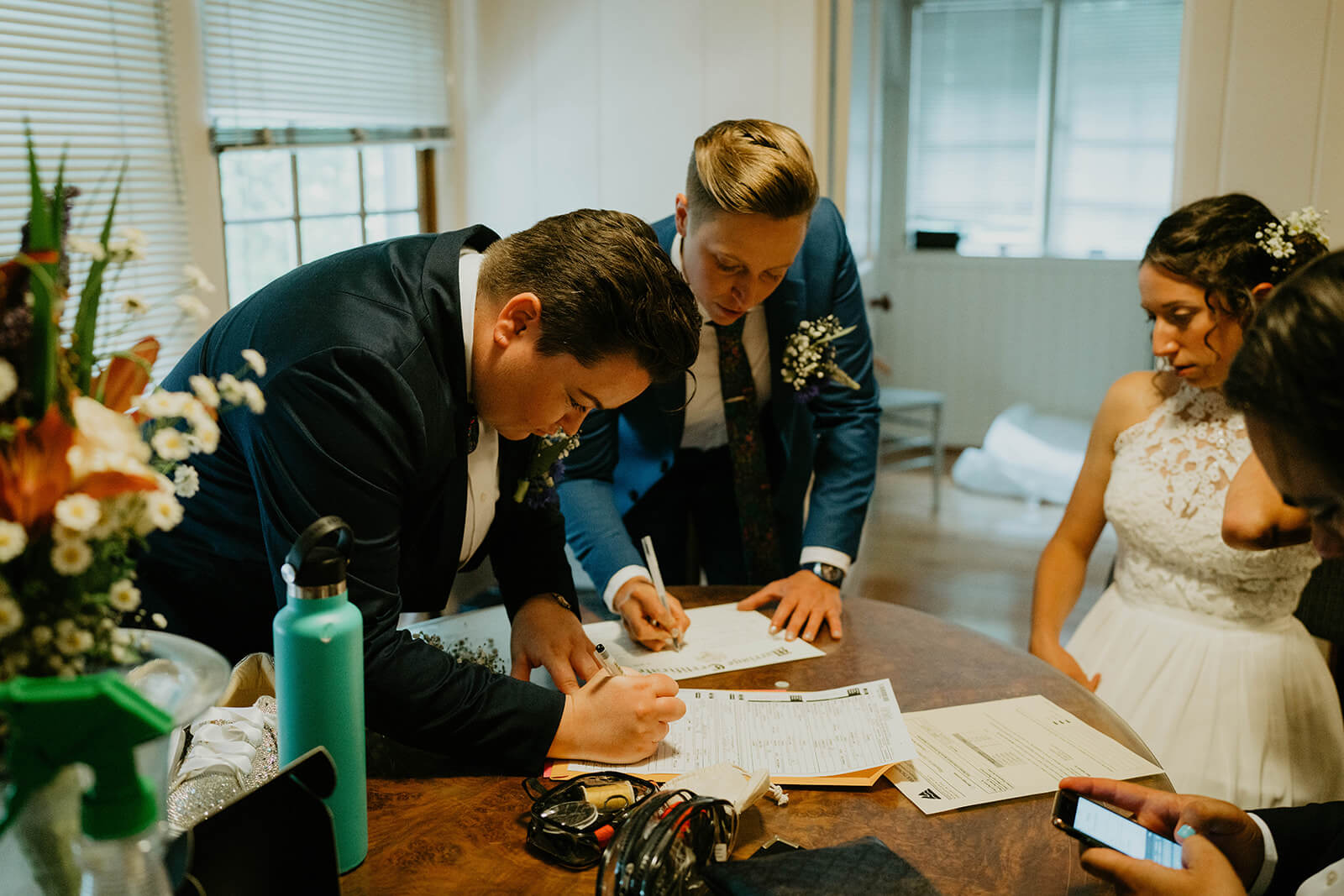 Bride signing marriage license