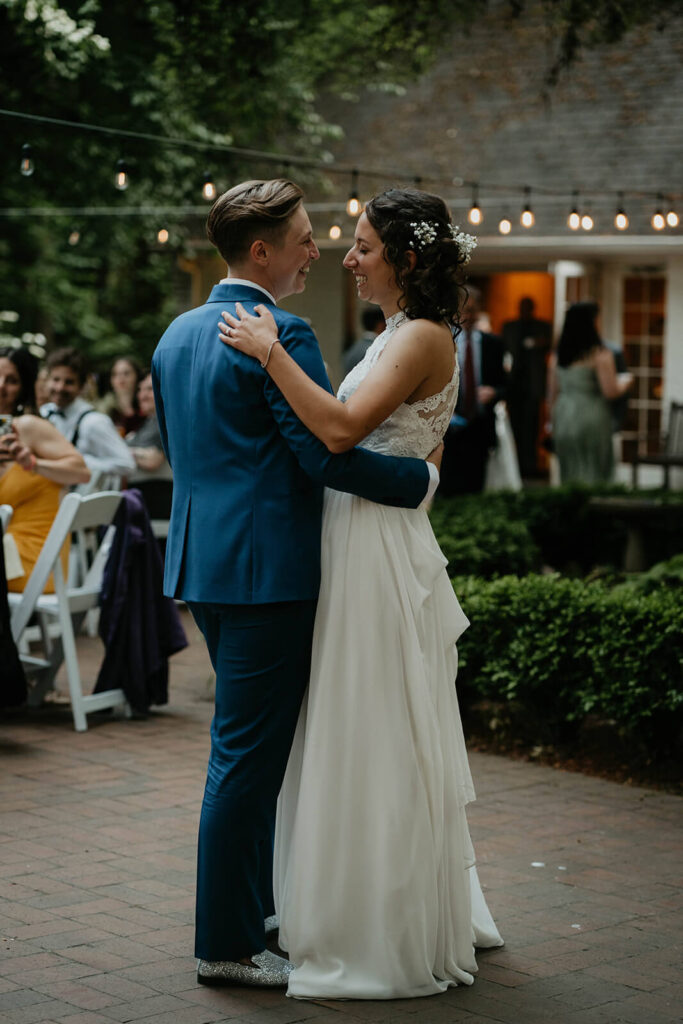 Two brides dancing at Leach Botanical Garden wedding reception