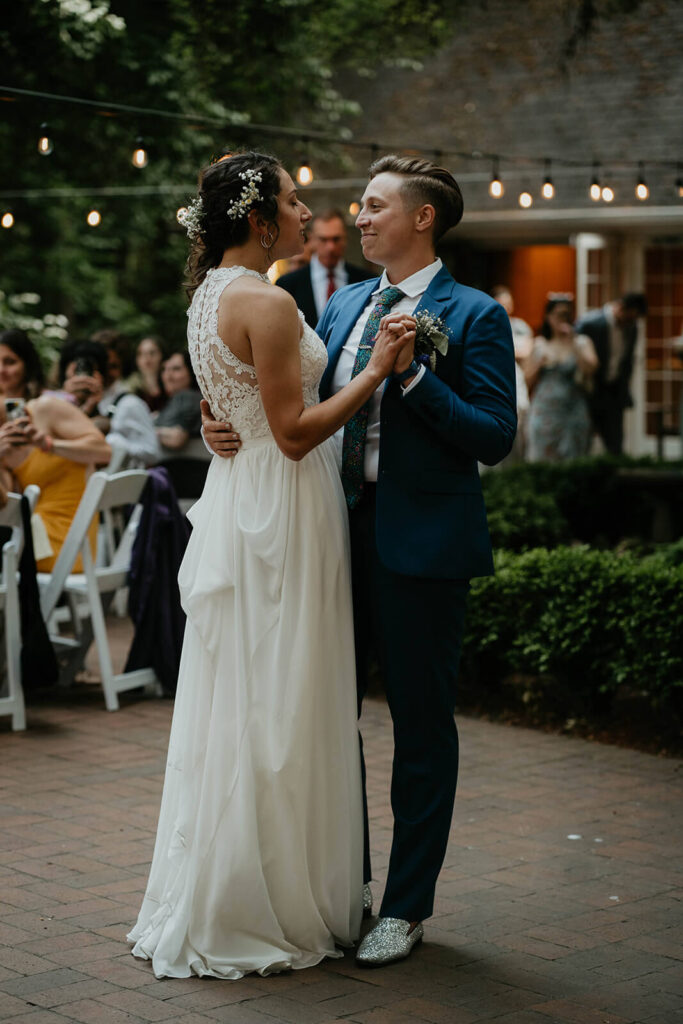 Two brides dancing at Leach Botanical Garden wedding reception