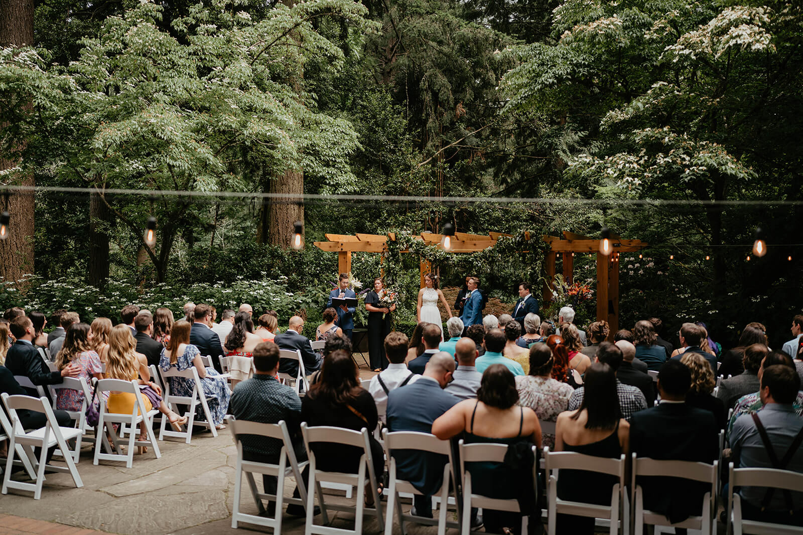 Two brides at Leach Botanical Garden wedding altar