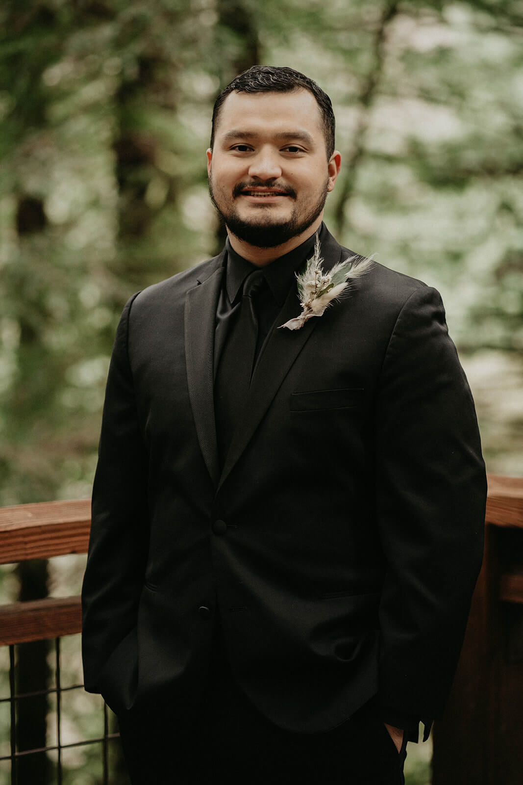 Groom portrait at forest wedding