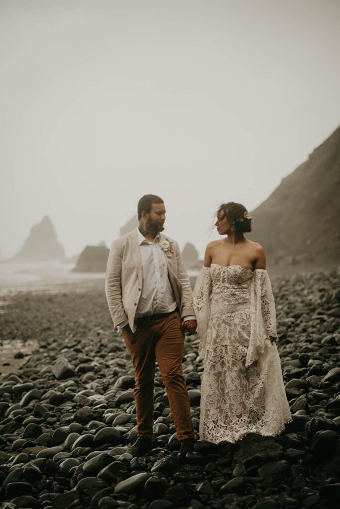 Bride and groom portraits in the rain on the Oregon coast