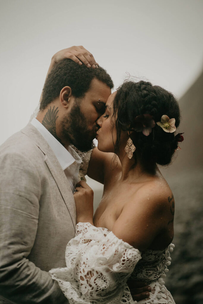 Bride and groom portraits in the rain on the Oregon coast