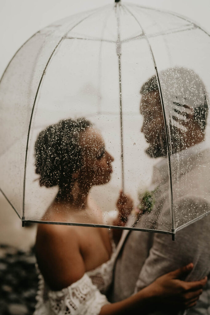 Bride and groom portraits in the rain on the Oregon coast