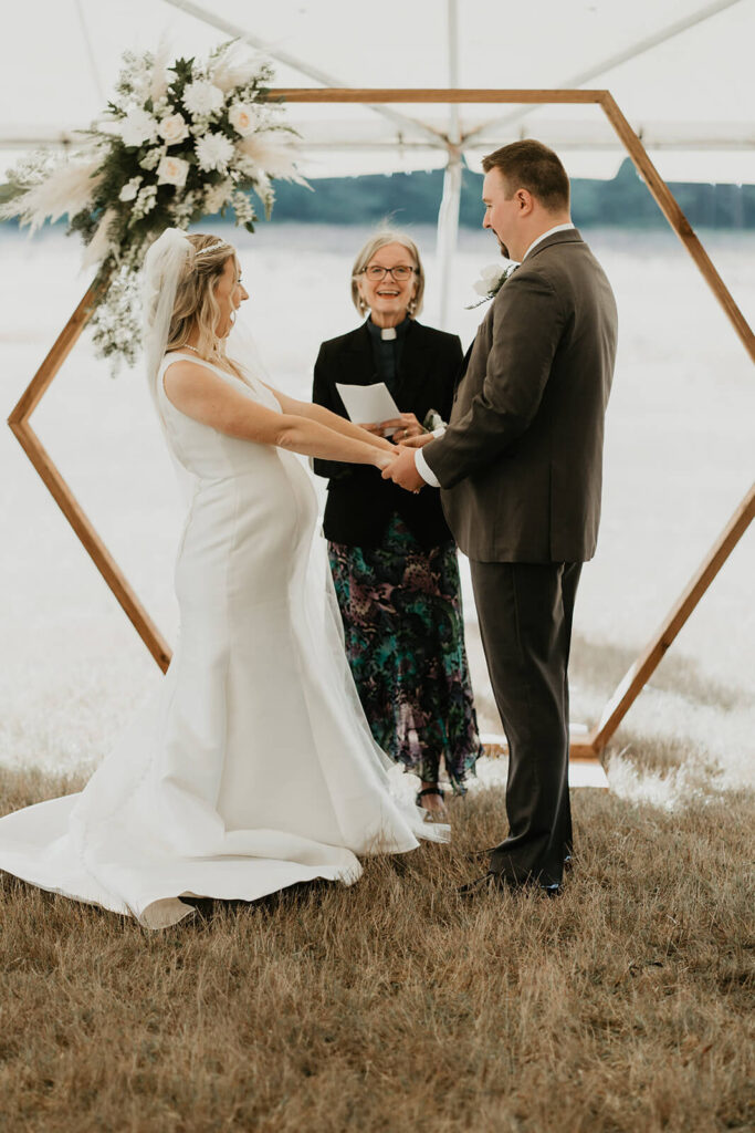 Bride and groom standing at the altar during Oregon wedding ceremony