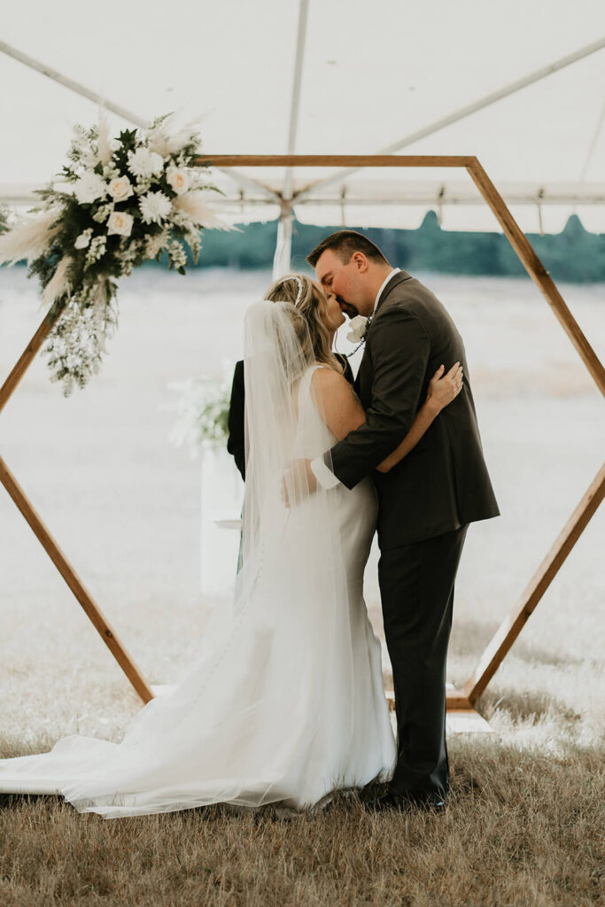 Bride and groom first kiss