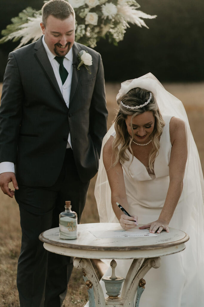 Bride and groom sign their Oregon marriage license