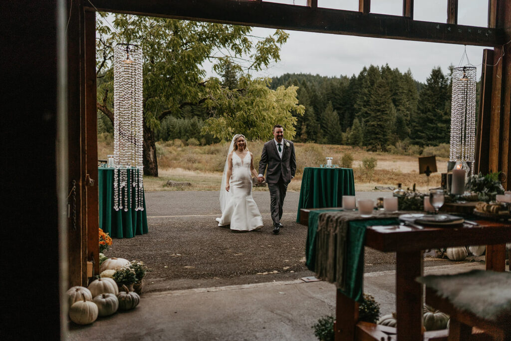 Bride and groom entering wedding reception