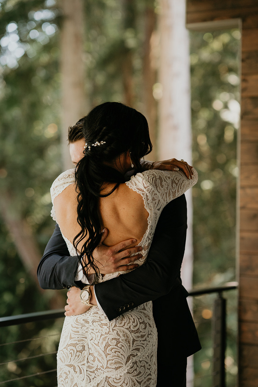 the bride and groom hugging. 