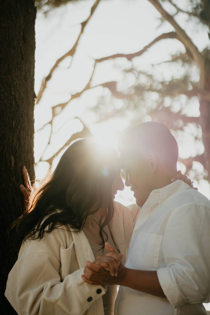 Two women holding hands during Oregon coast engagement