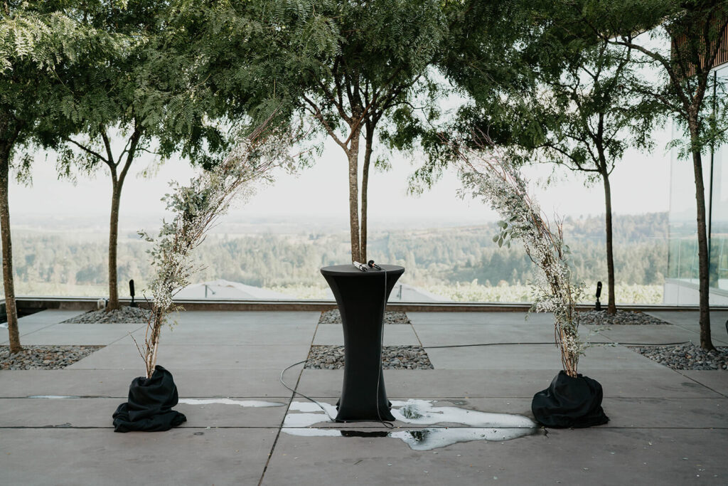 Simple floral arch at outdoor intimate wedding