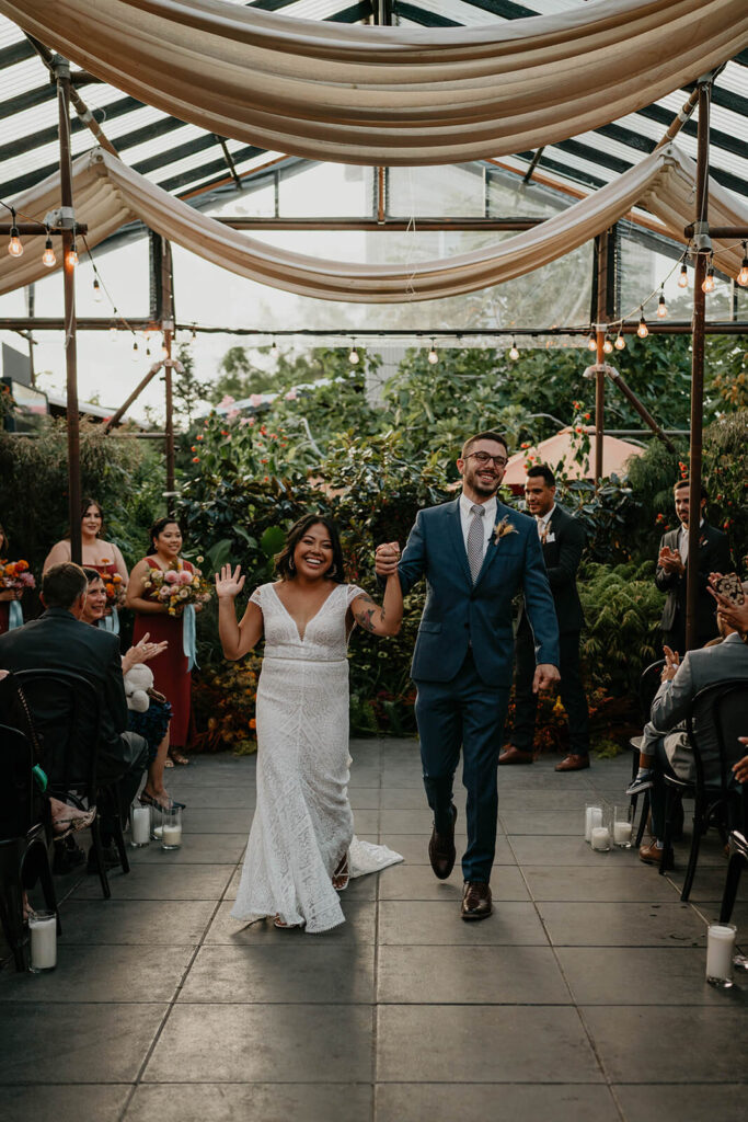 Bride and groom exit the ceremony at Blockhouse wedding