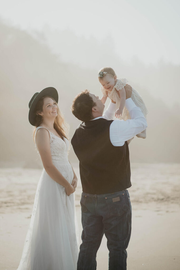 Family portraits during intimate beach wedding on the Oregon Coast