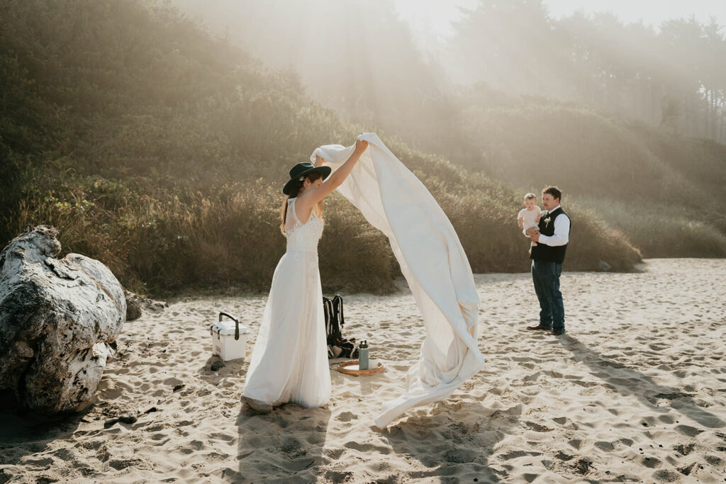 Bride setting up beach picnic