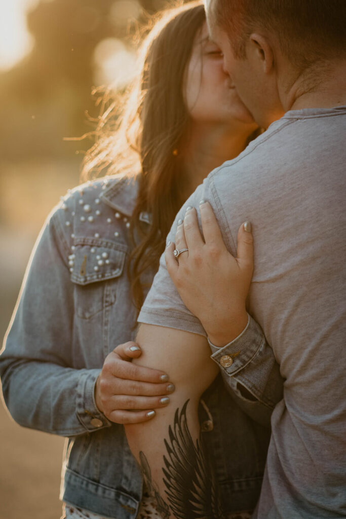 Couple kissing during Discover Park Seattle engagement session