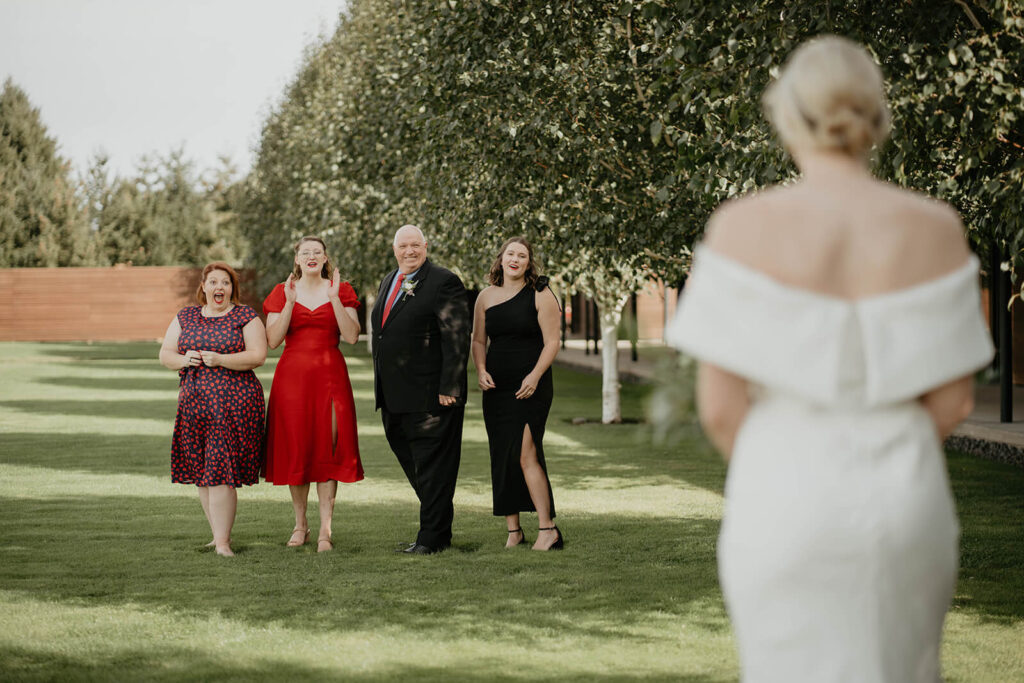 Bride first look with family at Willamette Valley Vineyards wedding