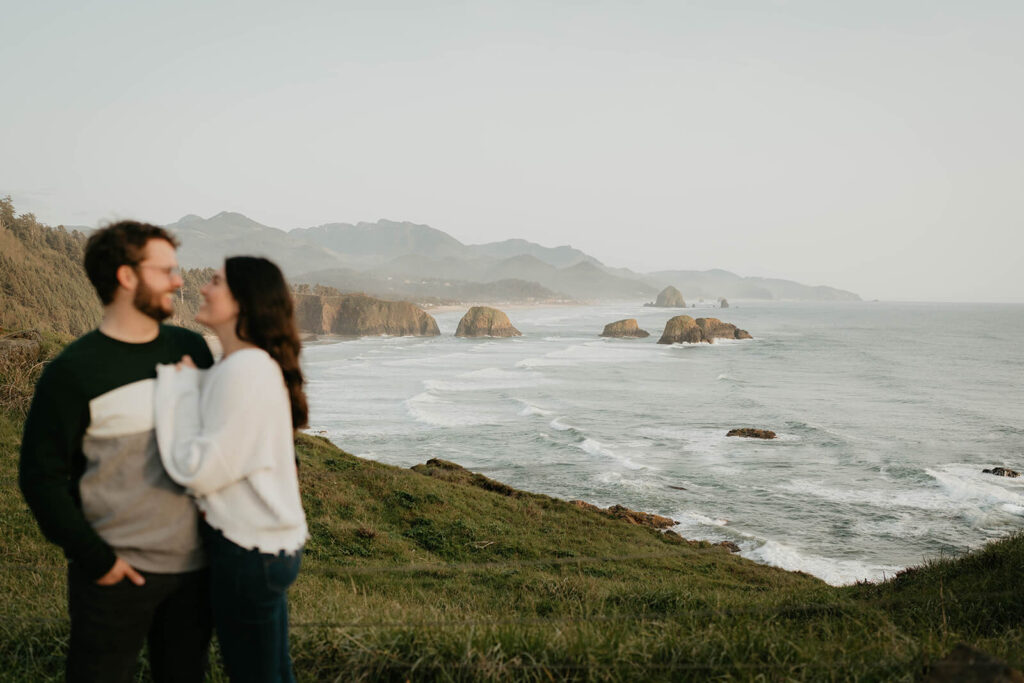 Couple portraits during beach engagement photos at Cannon Beach, Oregon