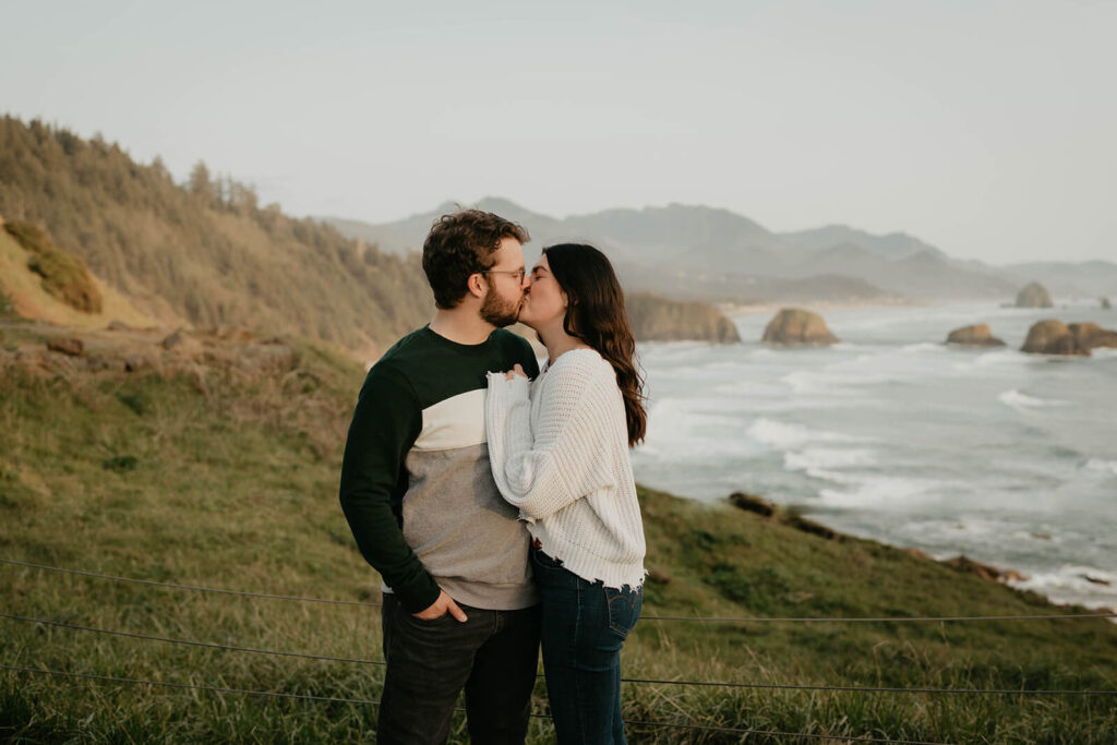 Couple portraits during beach engagement photos at Cannon Beach, Oregon