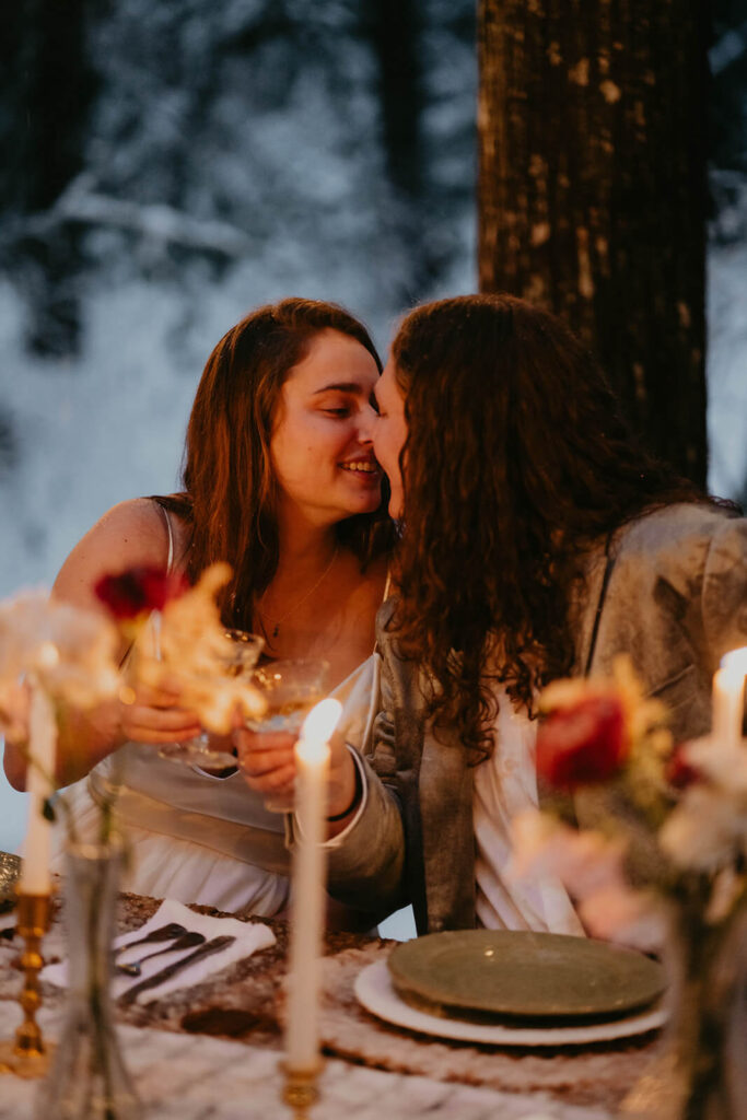 Dark moody wedding reception table at cozy Christmas cabin