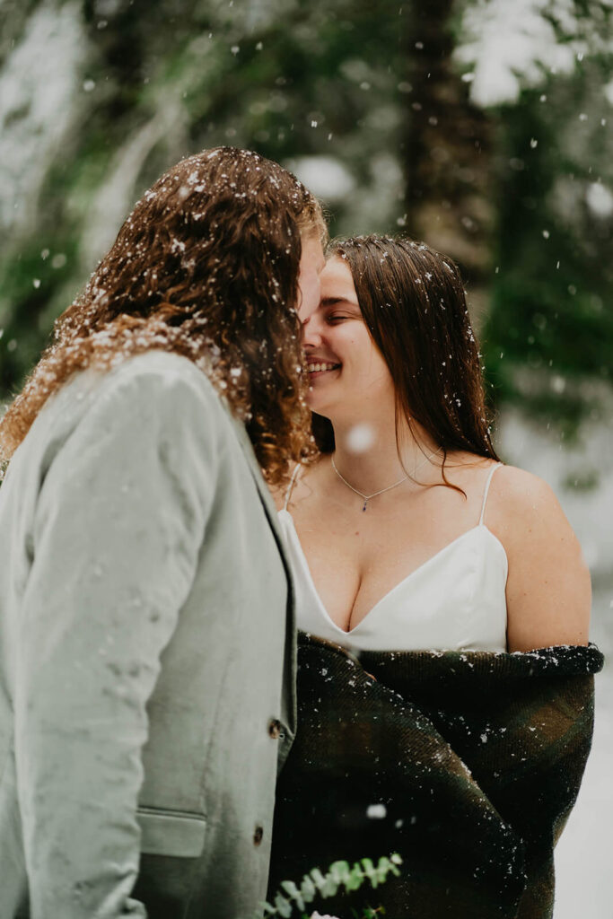 Couple portraits at cozy Christmas cabin elopement