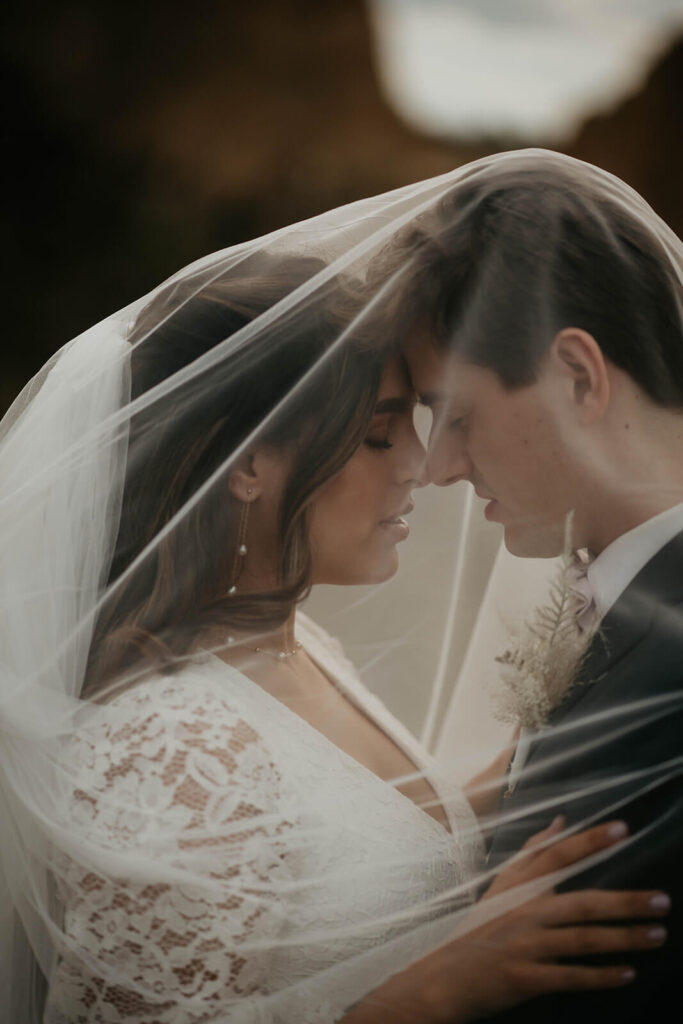 Bride and groom elopement portraits under the veil at Smith Rock elopement