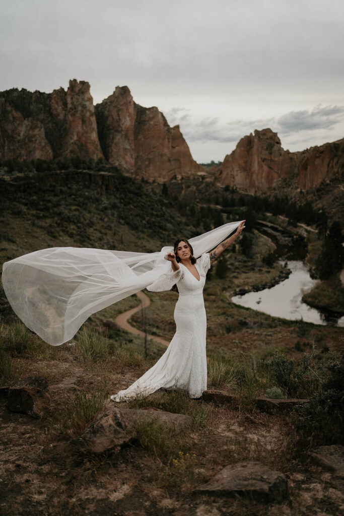 Bridal portraits at Smith Rock with long flowing veil