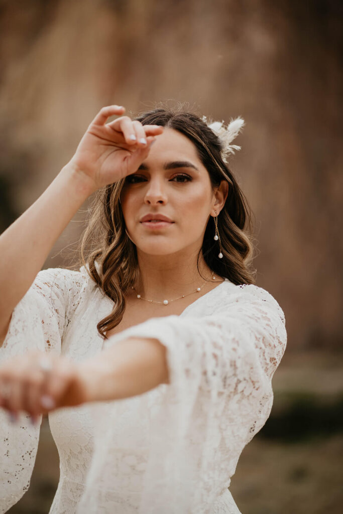 Bride wearing white lace boho wedding dress