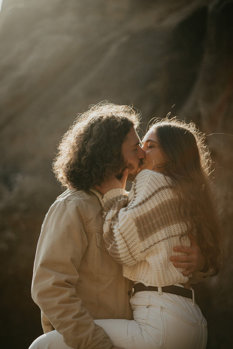 couple kissing during their engagement photo session.