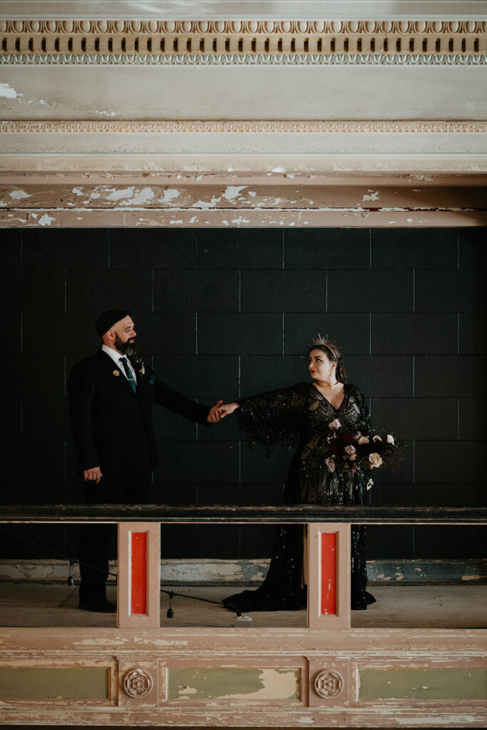 Bride and groom dark wedding portraits at the Ruins at the Astor