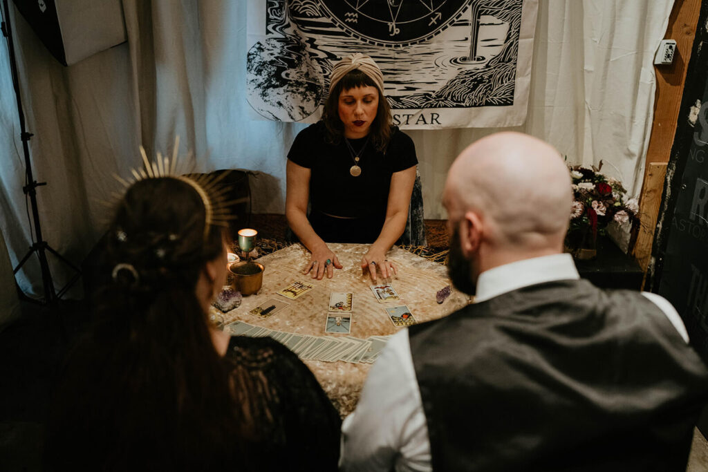 Tarot card reading at dark, moody fall wedding