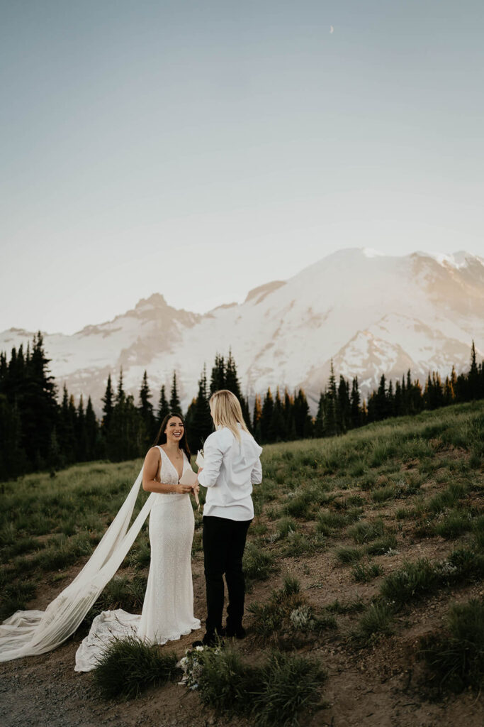 Two brides exchanging vows at Sunrise, Mount Rainier