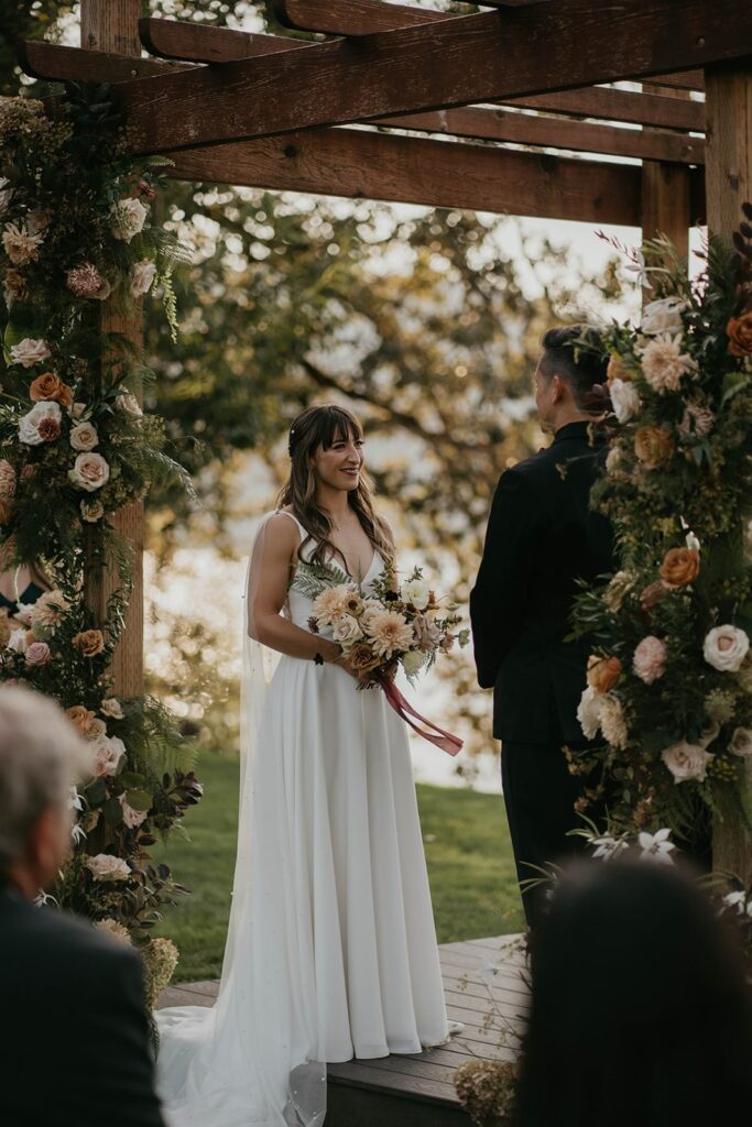 Bride and groom standing at the wedding altar on the Columbia River