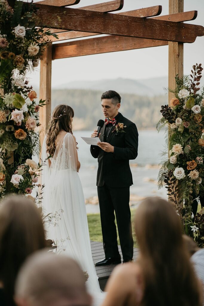 Groom reading vows during Thunder Island wedding ceremony