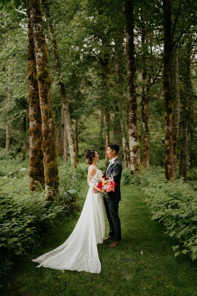 Bride and groom wedding portraits on the garden trail at Bridal Veil Lakes