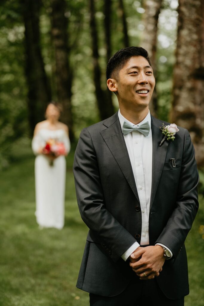 Bride and groom first look on the garden trail at Bridal Veil Lakes