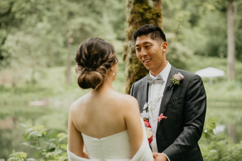 Bride and groom first look on the garden trail at Bridal Veil Lakes