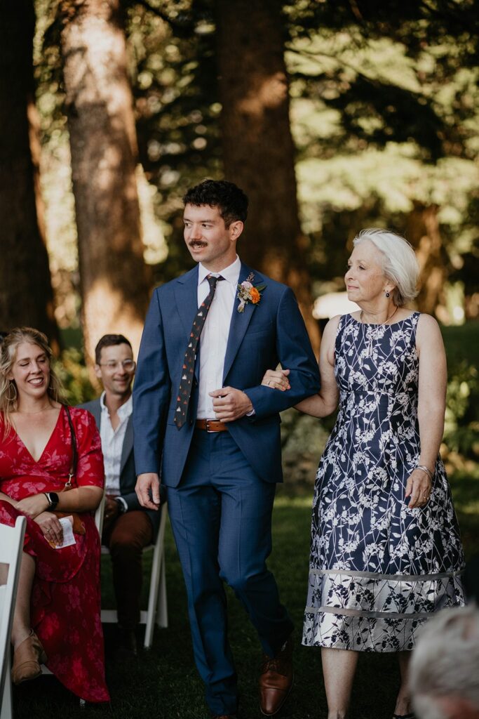 Groom walking down the aisle at Cascade Locks wedding