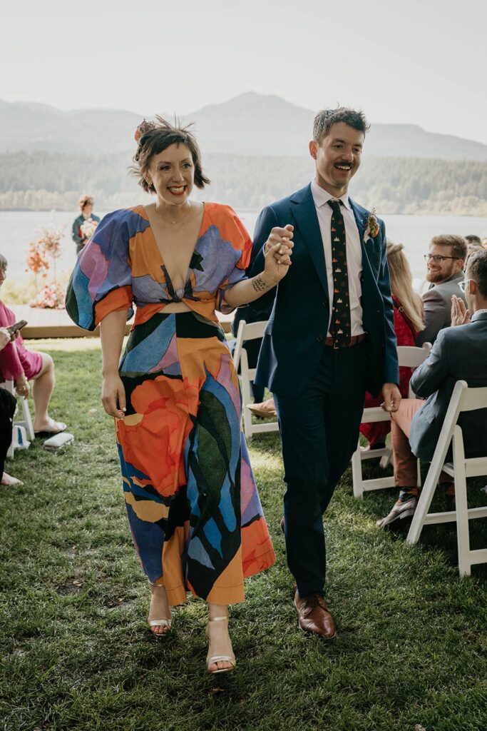 Bride and groom exit outdoor wedding ceremony at Cascade Locks wedding