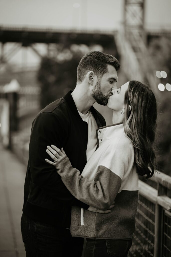 Couple kissing during fall engagement photos in Portland, Oregon