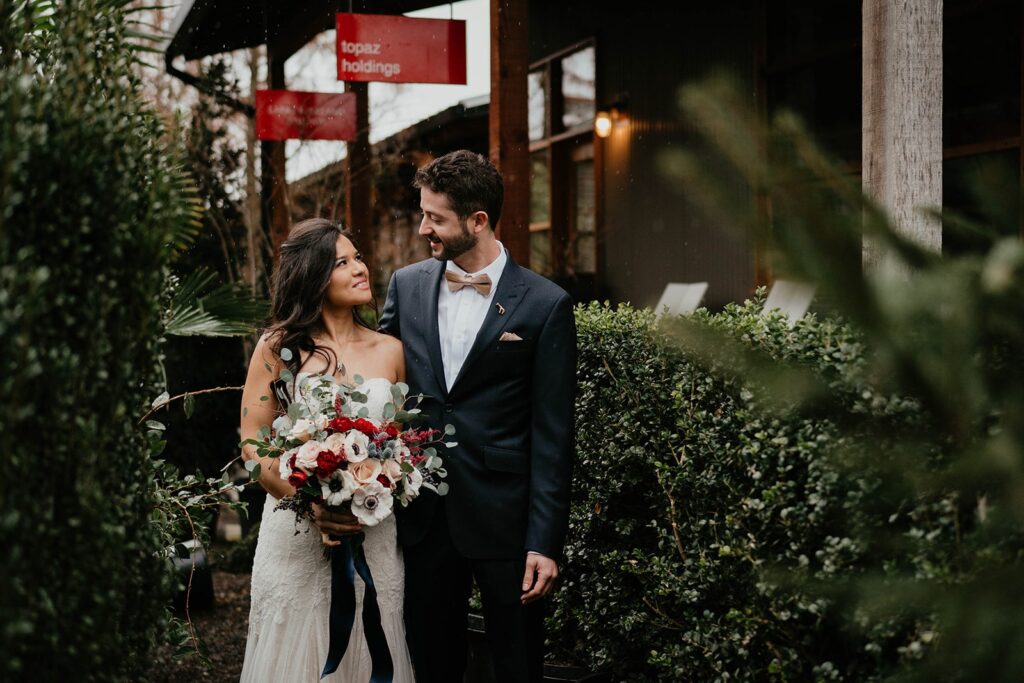 Bride and groom walking through Pomarius Nursery for their Blockhouse PDX wedding