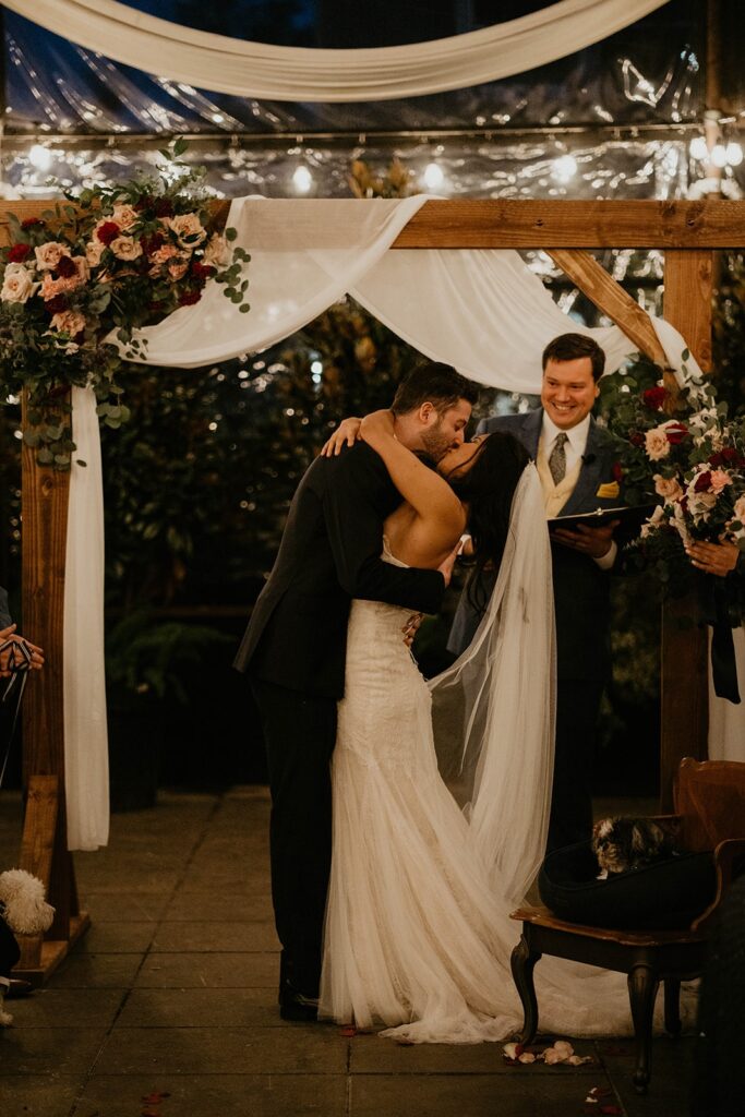 Bride and groom kiss during their Blockhouse PDX wedding