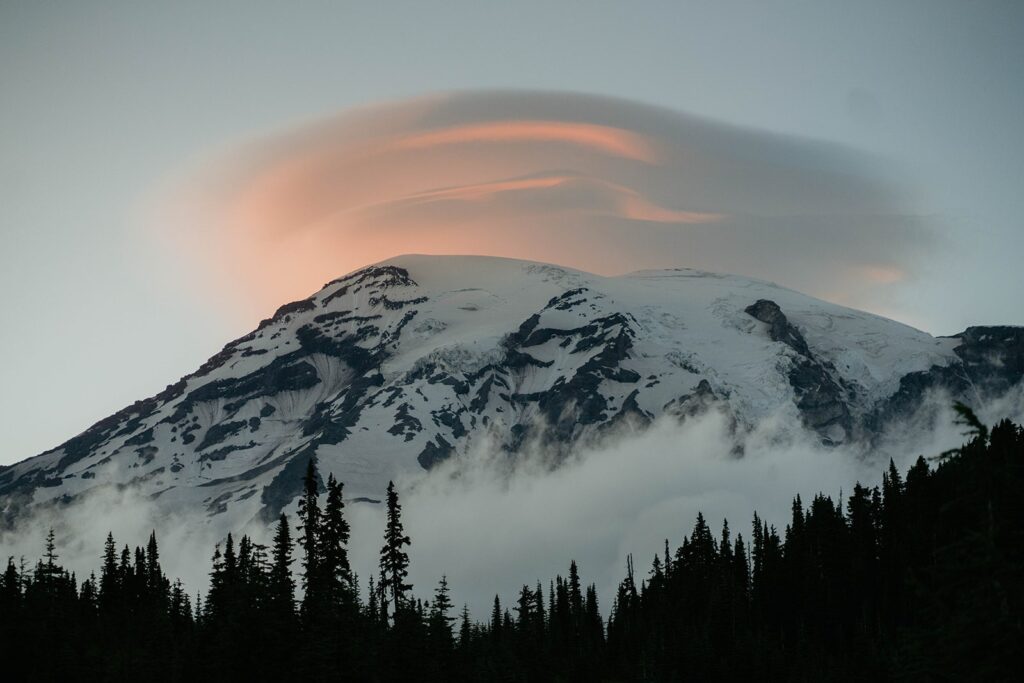 Lenticular cloud forming over Mt Rainier during summer engagement session