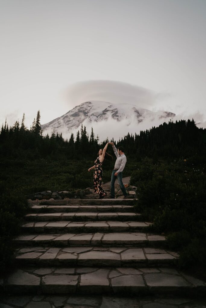 Couple dancing on the steps at Paradise during Mt Rainier engagement photos